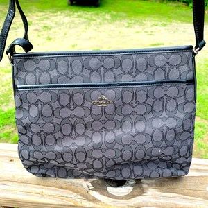 Lightly used black Coach C print crossbody bag.
